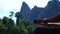 Boatman`s hands driving the longtail boat. Beautiful nature background.