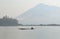 Boatman Sailing Motorboat In The River