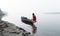 A boatman sailing through the waters of the river Brahmaputra in Guwahati, Assam, India