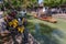 Boatman transports tourists by Chinese gondola on canal