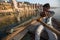 Boatmen on a boat glides through water on Ganges river along shore of Varanasi.