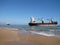 Boats aground at Saler beach, Valencia, Spain. Container ship after running aground. run aground after a gale wind storm