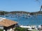 Boats anchored in the clear, placid waters of BÃºzios Bay