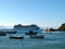 Boats anchored in the clear, placid waters of BÃºzios Bay