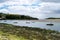 Boats anchored in Clonakilty Bay on a sunny day. Irish seashore at low tide, seaside landscape