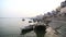 Boats anchored on the ghats of Ganges river in Varanasi.