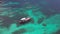 Boats Anchoring in Turquoise Shallow Water by the Edge of Coral Reef. Aerial View