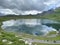 Boats on the artificial alpine lake Melchsee or Melch lake in the Uri Alps mountain massif, Melchtal - Switzerland