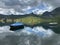 Boats on the artificial alpine lake Melchsee or Melch lake in the Uri Alps mountain massif, Melchtal - Switzerland