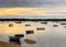 Boats in a bay between islands during a sunrise storm near Brisbane, Australia