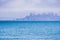 Boats on the bay waters, San Francisco skyline partially covered by fog in the background