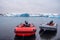 Boats on the beach coast of black sand volcanic rock stones in glacier lagoon Fjallsarlon mountains and glacier lagoon on the