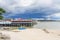 Boats on the beach and restaurants on stilts