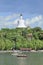 Boats on Beihai lake with Tibetan Stupa on top of the hill, Beijing, China