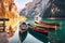 Boats on Braies lake in Dolomite mountains, Sudtirol, Italy. Nature park Fanes-Sennes-Prags, Dolomite, Italy, Europe. Generative