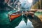 Boats on Braies lake in Dolomite mountains, Sudtirol, Italy. Nature park Fanes-Sennes-Prags, Dolomite, Italy, Europe. Generative