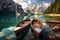 Boats on the Braies Lake in Dolomites mountains, Sudtirol, Italy