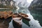 Boats on the Braies Lake ( Pragser Wildsee ) in Dolomites mountains