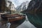 Boats on the Braies Lake ( Pragser Wildsee ) in Dolomites mountains