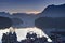 Boats in calm harbor marina at sunrise Tofino British Columbia Canada