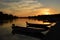 Boats in calm water at sunset