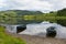 Boats calm water Watendlath Tarn Lake District Cumbria England UK