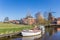 Boats in the canal of historic village Eenrum