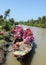 Boats carrying flowers on the river in Thap, Vietnam