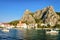 Boats and church at harbor in Cetina River in Omis