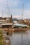 Boats in Clifden bay pier with village in background