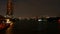 Boats cruising on the Chao Praya River at dusk.