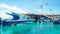 Boats docked in the port with crystal clear water