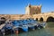 Boats docked in the port Skala fort at Essaouira in Morocco.
