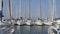 Boats docked at sailing sport club, racing yachts floating on water at marine