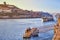 Boats on Douro river with view on  Red roofs of side Villa Nova de Gaia  in Porto. Concept of world travel, sightseeing and