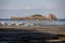 Boats on dry land at the beach at low tide in Cancale famous oysters production town, Brittany,