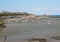 Boats on dry land at the beach at low tide in Cancale famous oysters production town, Brittany,