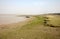 Boats of fishermen stranded in the mud at low tide on the coast of Bay of Bengal