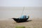 Boats of fishermen stranded in the mud at low tide on the coast of Bay of Bengal