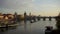 Boats floating under the Charles bridge at sunset, Prague, Czech Republic.