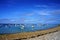 Boats floating in the water near a pebbles beach in Brittany