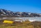 Boats at frozen turquoise lake Vavatn panorama landscape Hemsedal Norway