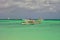 Boats on the green Caribbean sea in the tropical island of Aruba.