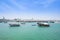 Boats in  harbor Doha with turquoise Persian Gulf water Qatar
