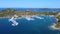 Boats in harbor. Motorboats and sailboats in harbor on sunny summer day. Aerial view