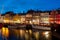 Boats at the harbor in Nyhavn at night