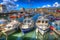 Boats in harbour with cloudscape West bay Dorset England UK on calm summer day