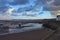 Boats in the harbour at Minehead in Somerset. The tide is out and the sky is stormy