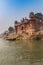 Boats and historic buildings at the Chet Singh Ghat in Varanasi