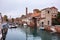 Boats and houses in a canal in Giudecca island